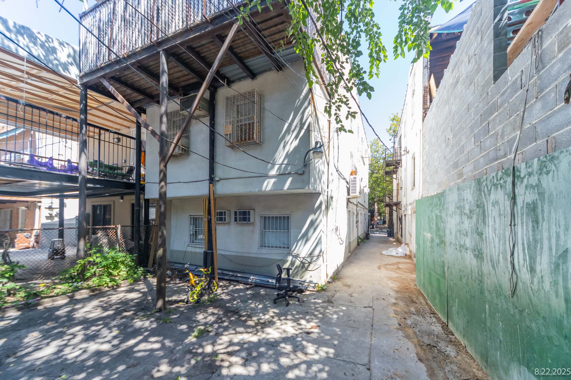 Rear building envelope and alleyway existing conditions recorded for an OpenDoors360 pre-construction survey in New York City.